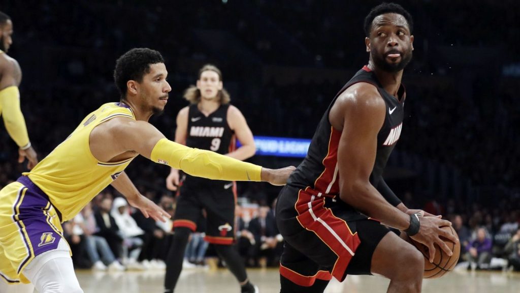 Dwyane Wade and Josh Hart