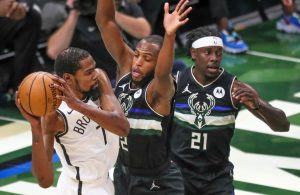 Jrue Holiday, Khris Middleton and Kevin Durant